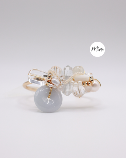 Jade donut bangle with crystal elements on gold cuff bangle